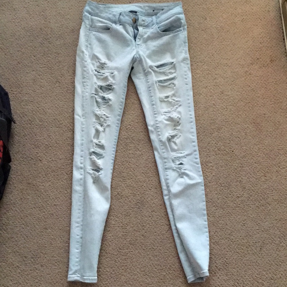 Light wash ripped American Eagle jeans.
